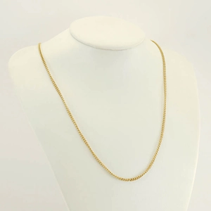 Elegant gold stainless steel curb chain necklace shown on a white jewelry bust