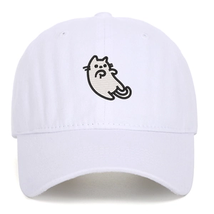 Close-up of the detailed cartoon cat embroidery on a white cotton baseball cap