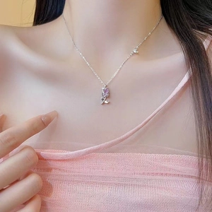 Silver tulip necklace with purple zircon drop pendant worn on woman neck