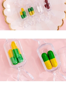Macro view of transparent candy-shaped plastic storage boxes for jewelry and pills
