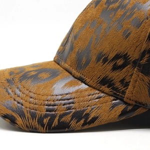 Detail of leopard print baseball cap featuring high-quality leather and flocking texture