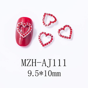 Macro detail of red heart-shaped nail rhinestones with silver metal base and 9.5x10mm size