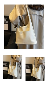Close-up of cream white PU leather shoulder bag featuring precise stitching and front pocket
