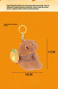 Close-up of brown plush capybara keychain with small yellow backpack and metal ring