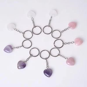 Natural heart-shaped crystal keychains in various gemstones like amethyst and rose quartz