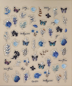 Detail of 5D nail art stickers featuring blue butterflies and floral art patterns