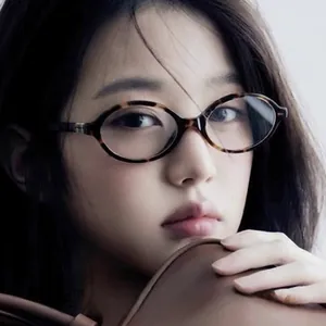 Close-up of leopard print cat-eye sunglasses on model showing trendy oval metal frame