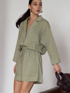 Women's sage green linen shirt and shorts two-piece set displayed on a model
