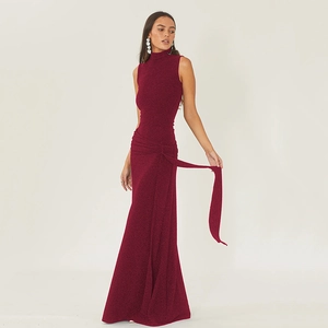 Sleeveless burgundy evening dress with high neck and wrap tie waist in shimmer fabric