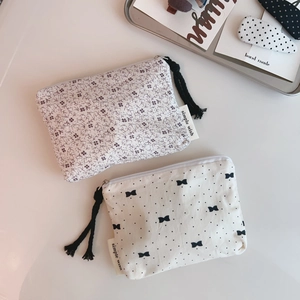 Floral and polka dot cotton fabric mini pouches with zipper and tassel details