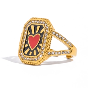Vintage gold heart ring with red enamel and shimmering rhinestones in a sunburst design