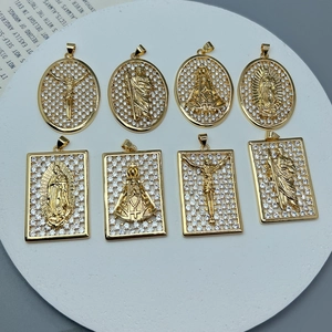Colgantes Guadalupe y San Judas dorados con circonitas sobre una base blanca