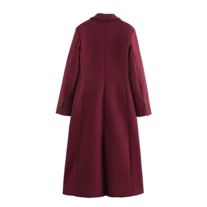 Detail view of burgundy coat back with long sleeves and black button cuff accents