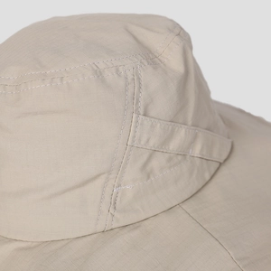 Close-up of ripstop nylon fabric and stitching detail on outdoor sun protection hat