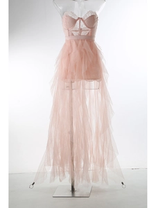 Detail of pink mesh tulle dress featuring intricate lace bodice and flowing layered skirt
