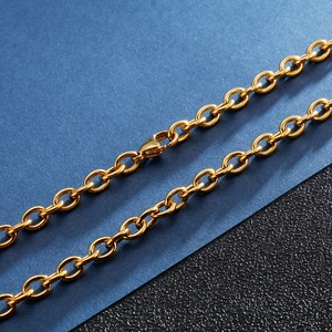 Detailed close-up of golden stainless steel link chain featuring a secure lobster clasp