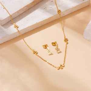 Polished gold plated stainless steel jewelry set featuring snake pendant necklace and earrings