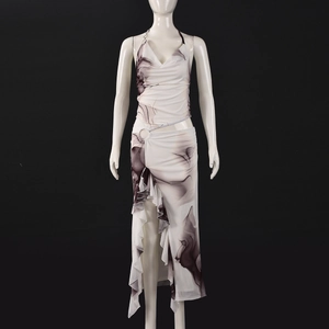 Detail view of marble print halter top and ruffled maxi skirt with high side slit