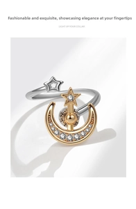 Macro shot of silver star and gold moon rotating ring with shimmering zircon details
