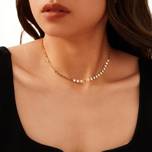 Elegant gold S925 sterling silver necklace featuring linked round discs on a female model