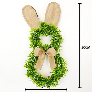 Détail d'une couronne de Pâques lapin 50x25cm avec feuilles vertes et oreilles en toile