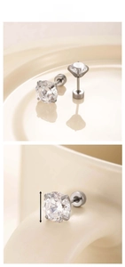 Detail of 8mm round cubic zirconia stud earring with four-prong silver stainless steel setting