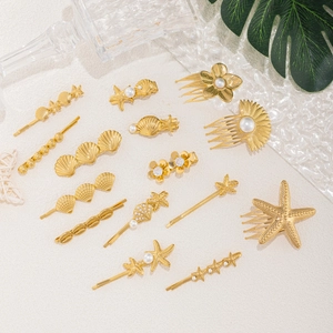 Golden ocean theme hair accessory set with starfish, shells and pearls for brides