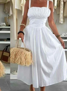 Elegant white strapless midi dress with a flowing A-line skirt for a sophisticated look