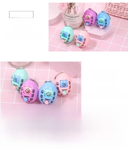 Macro shot of colorful egg-shaped rock-paper-scissors game keychains in pastel colors