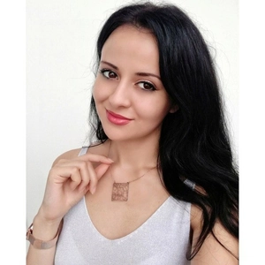 Detail showing square hollow city map necklace in rose gold finish on model