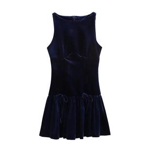 Detailed view of navy blue velvet mini dress with pleated hem and delicate bow accents