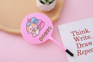Pink cartoon fan pen with sweet text on a wooden tray with a succulent and card