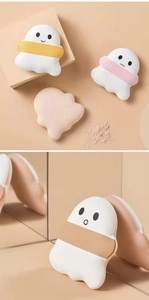 Close-up of soft ghost-shaped air cushion powder puffs with cute cartoon facial expressions