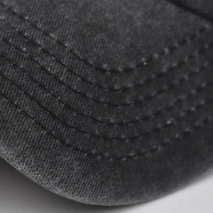 Macro shot of durable washed cotton canvas fabric with 6-row stitching on the visor brim
