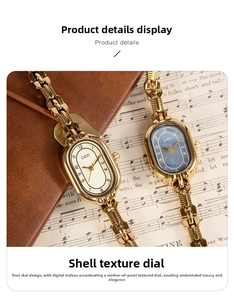 Detail of GEDI oval vintage watches with gold chain straps and blue shell texture dials