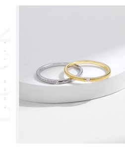 Macro detail of S925 silver rings with irregular foil texture and micro-set zircons