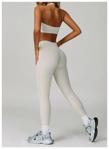 Detail view of high-waist yoga leggings with V-shaped stitching for a butt-lifting effect