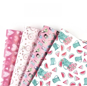 Detail view of four illustrated gift papers with hearts, cactus, and bicycle patterns