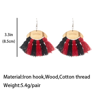 Rugby wooden earrings with red and black cotton fringe tassels on a clean white background