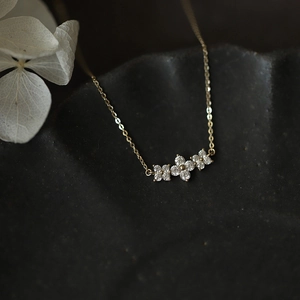 Elegant gold-plated S925 sterling silver necklace with sparkling clover flower pendants