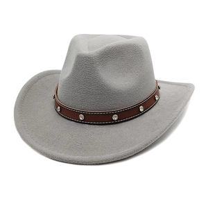 Detail view of grey felt cowboy hat featuring a brown leather band with silver studs