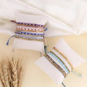 Bohemian handmade woven bead bracelets with adjustable silk cords and metallic accents
