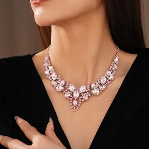 Vintage waterdrop crystal floral necklace in silver finish with pink gemstones on model