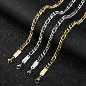 Detail of gold and silver titanium steel necklaces with blank rectangular plates