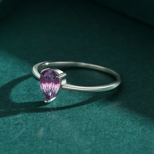 Elegant S925 silver ring with a pear-cut pink tourmaline gemstone on green velvet