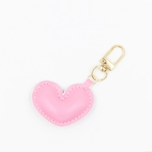 Pink heart-shaped PU leather keychain with gold metal hook and chain on white background