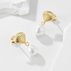 Detailed view of the S925 hallmark on the gold shell pearl earring with freshwater pearl