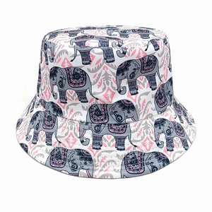 Detailed view of bohemian elephant pattern and floral motifs on bucket hat fabric