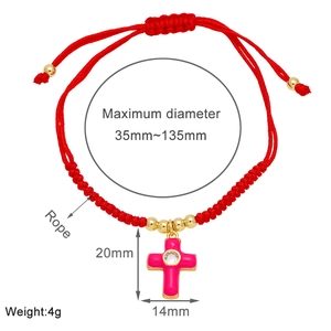 Detail of red braided bracelet with adjustable knots and pink enamel cross pendant size