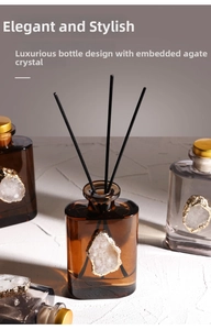 Detailed view of luxury reed diffuser with gold-edged agate stone inlay and fiber sticks